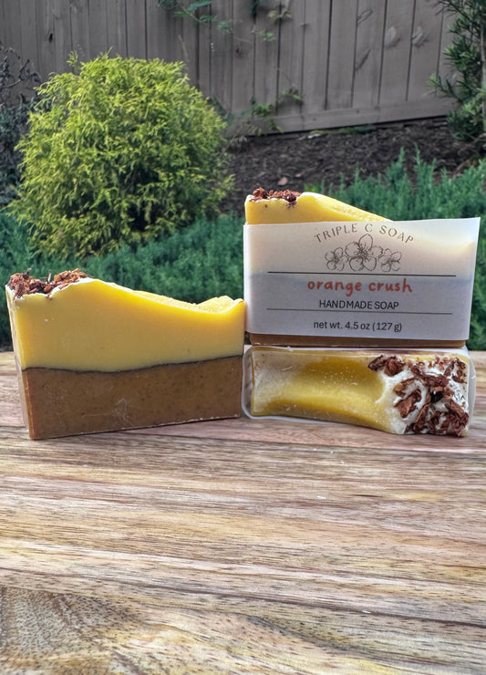 Handmade soap with a visible label on a wooden surface outdoors